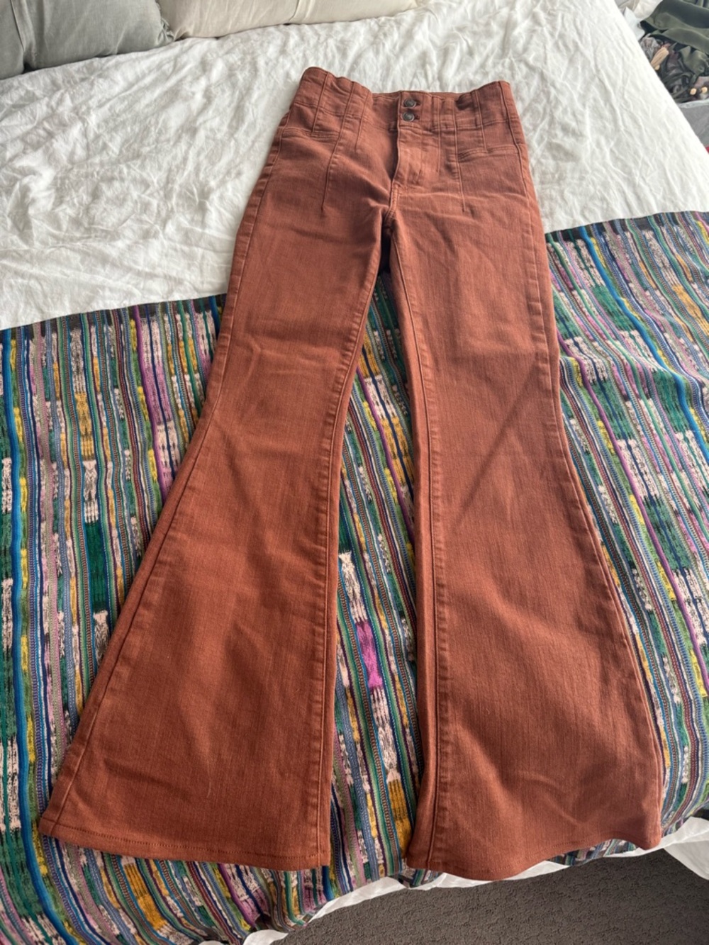 Free People High-Rise Flared Jeans in Rust Brown